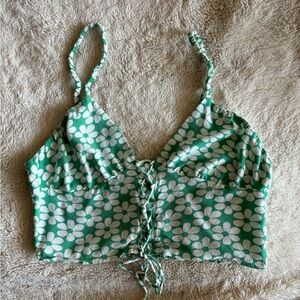 Green and white crop top with floral pattern and with front lace up style